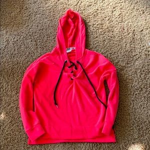 Pink sweater/hoodie with tie in the front
